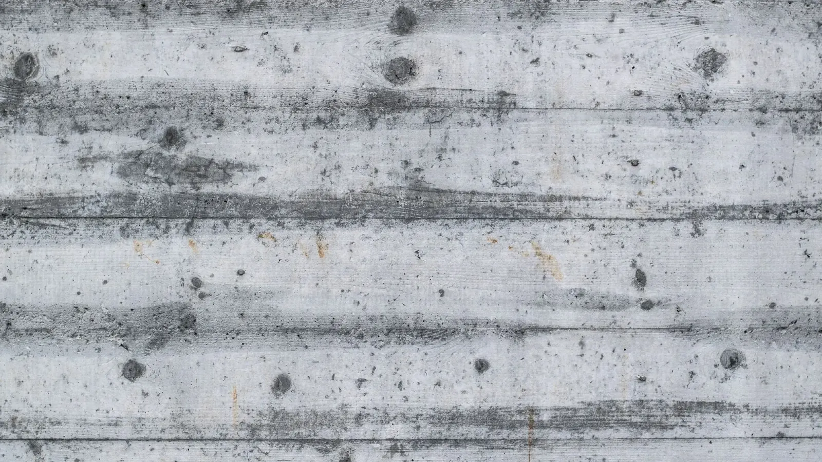 Close view of a board-formed concrete surface showing its grain and texture